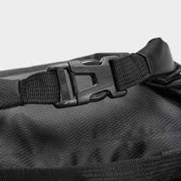 A black dry bag featuring a durable buckle and textured interior. It includes a logo on the surface.