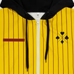 A yellow and black zipped hoodie featuring vertical stripes, a logo, and a contrasting red stripe.