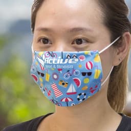 A reusable face mask in blue with colourful patterns, featuring a logo, suitable for health and personal use.