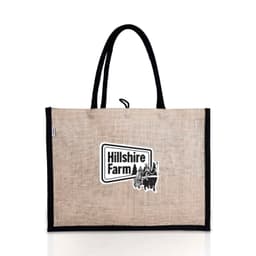 A jute bag in beige with black handles and a logo on the front.